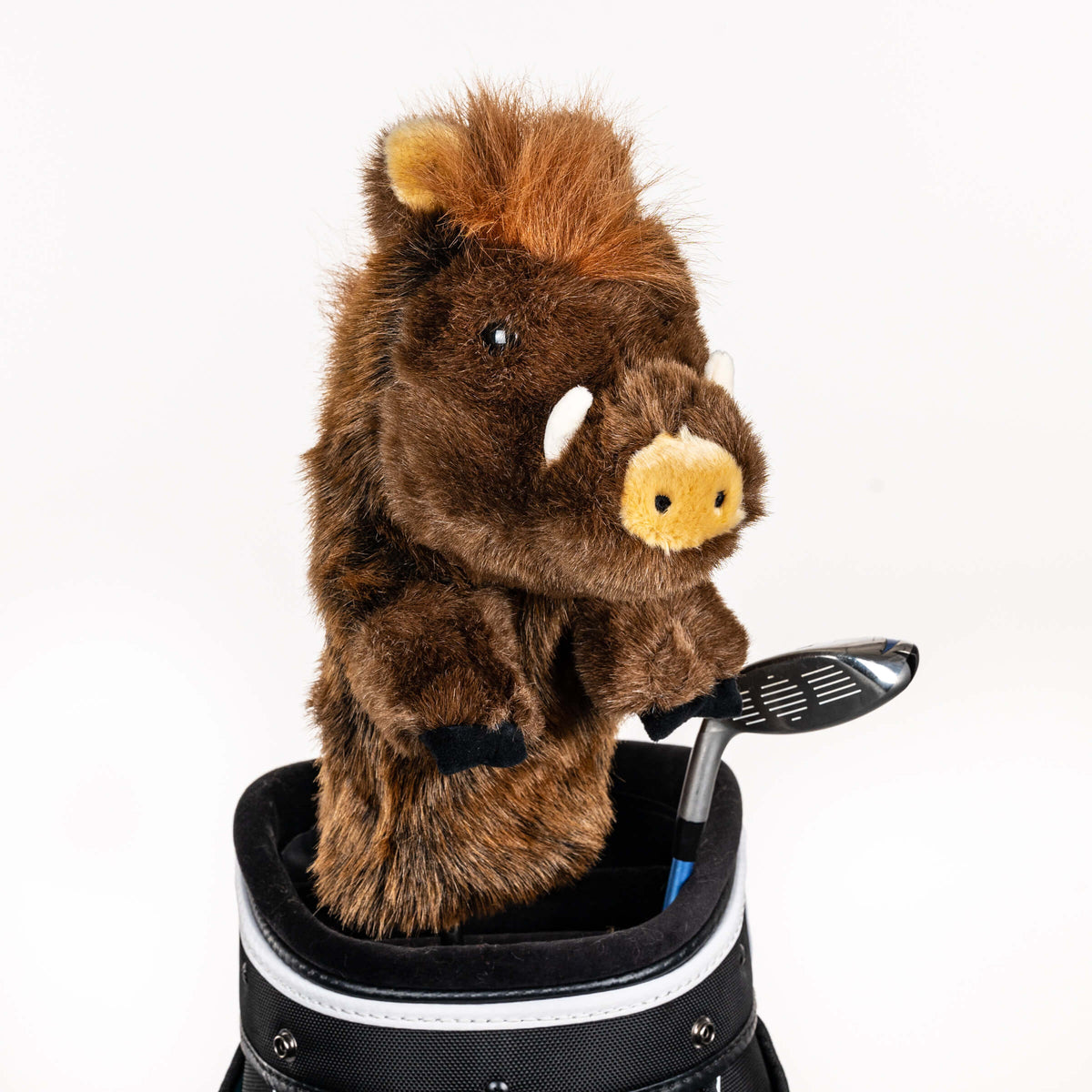 Plush wild boar golf headcover covering a club in a golf bag, a standout golf gift for men from Groovy Guy Gifts