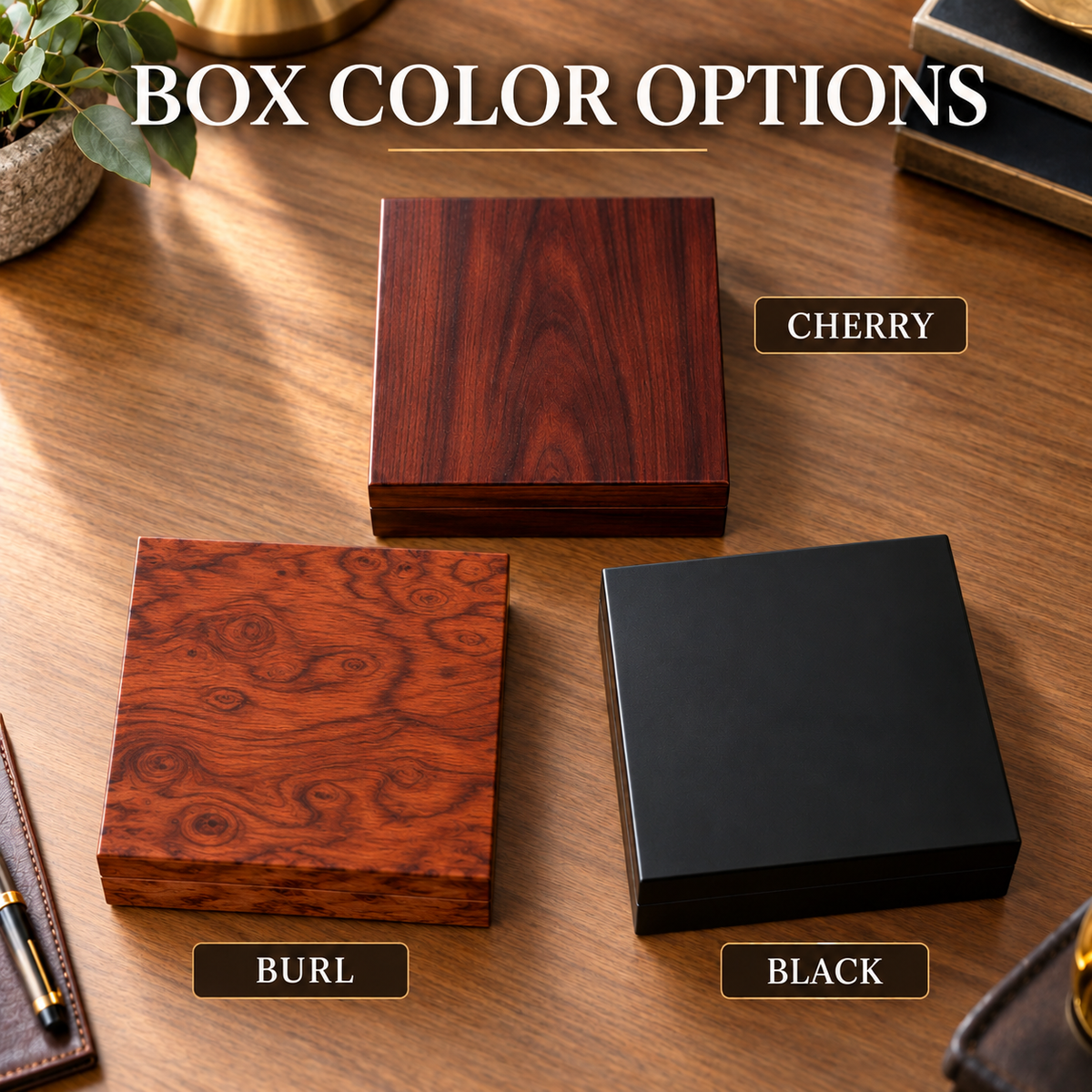 Three wooden gift boxes displayed on a desk showing Cherry, Burl, and Black finish options with wood grain and high-gloss details