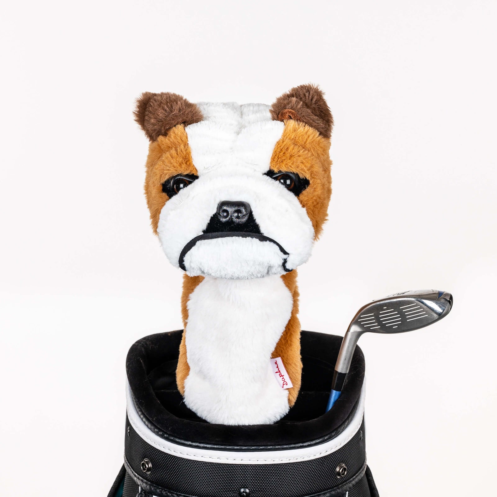 Plush bulldog golf headcover covering a club in a golf bag, a standout golf gift for men from Groovy Guy Gifts
