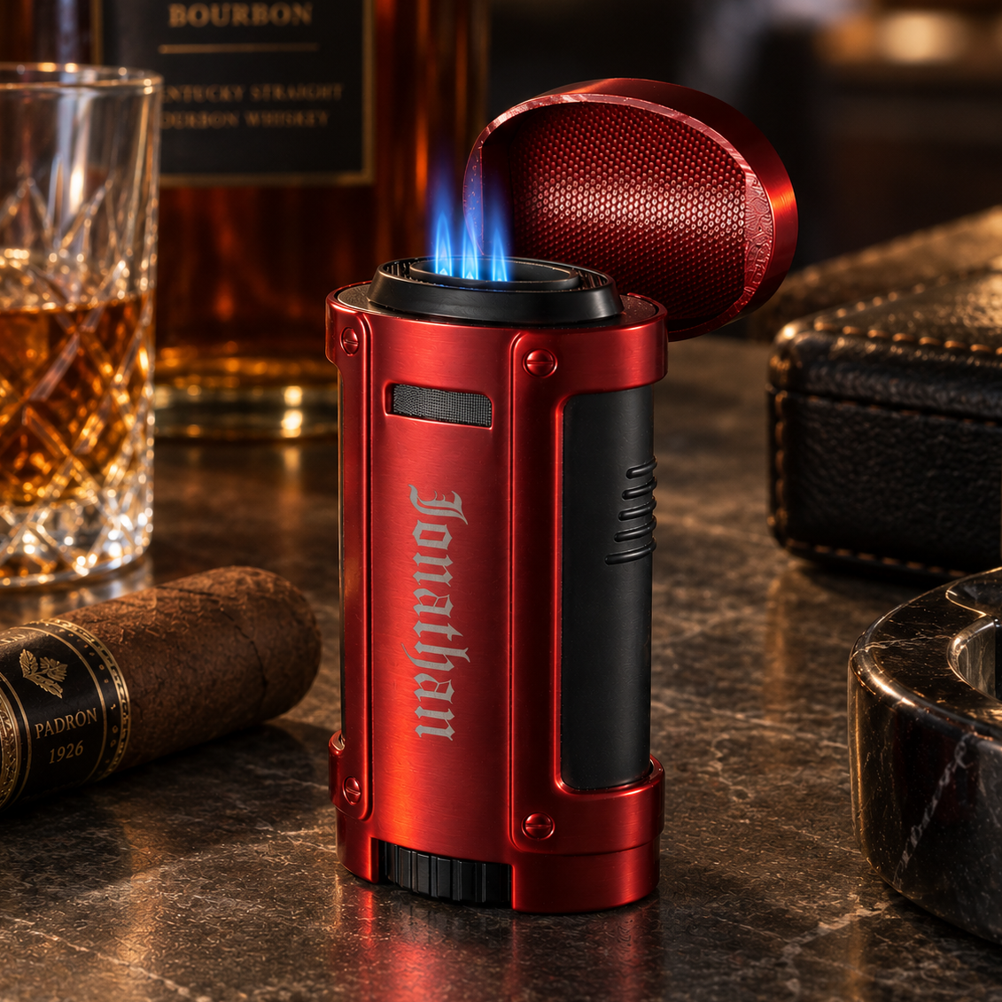 Personalized red quad flame cigar lighter with the cap flipped open, four blue torch flames burning and the name Michael engraved down the front with Whiskey glass and cigar in background