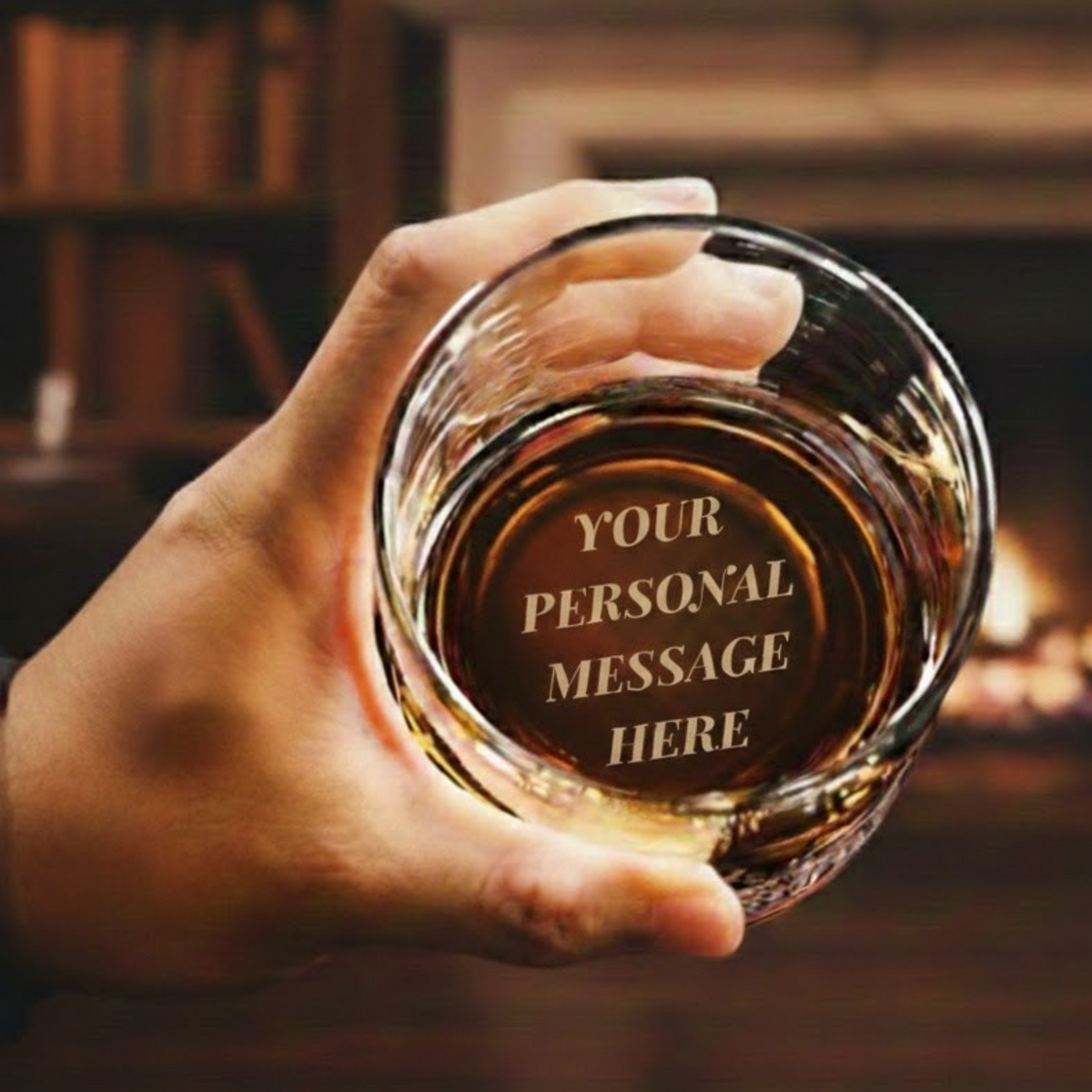 Hand holding a glass of whiskey with 'Your Personal Message Here' text against a warm, blurred background.
