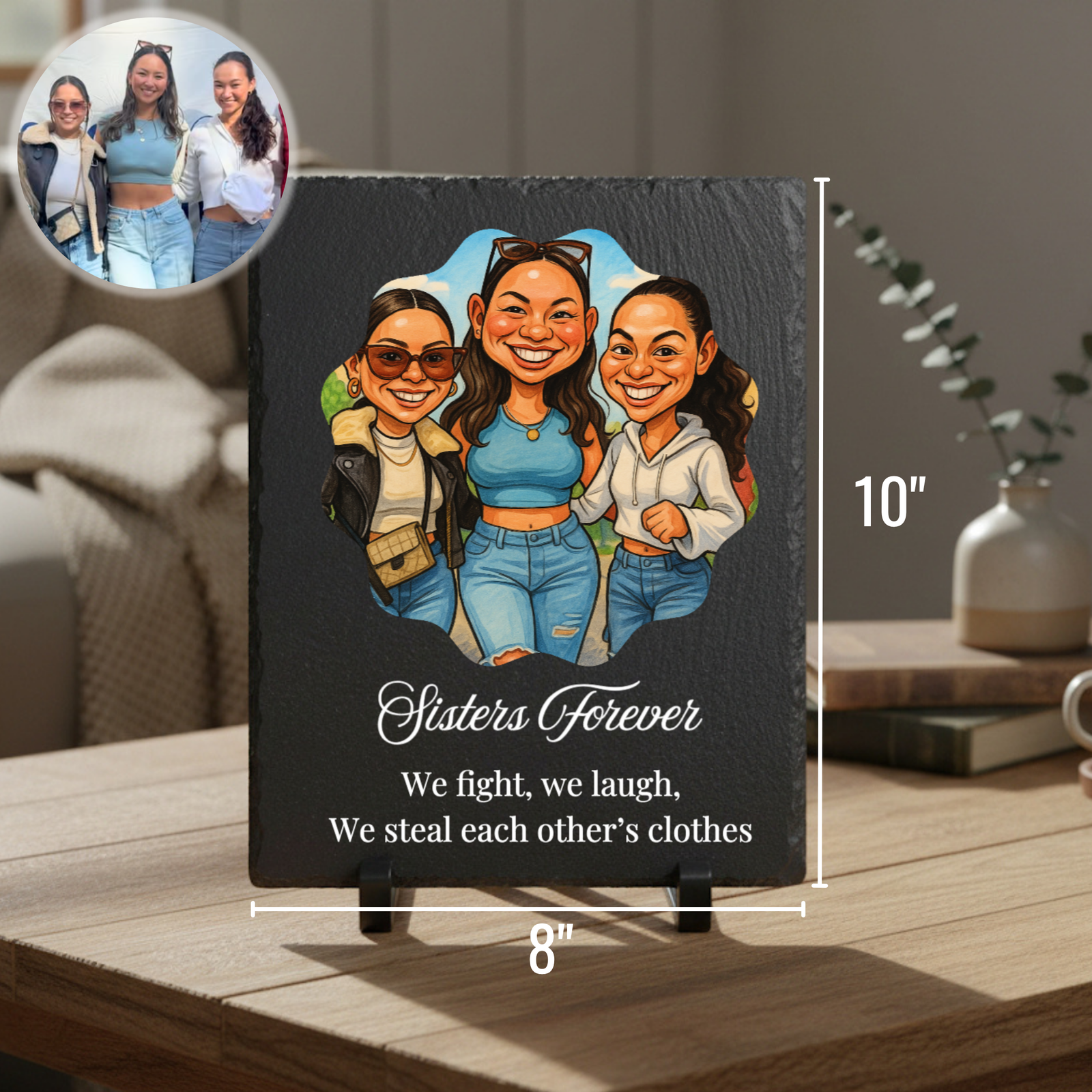 Black slate plaque featuring colorful caricature illustration of three women with sample text "Sisters Forever" and custom message, displayed on wooden surface with reference photo inset above