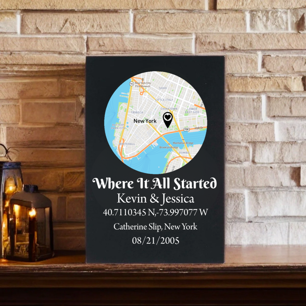 Black leatherette sign with circular map showing New York City, engraved with sample text "Where It All Started Kevin & Jessica" and sample coordinates and date