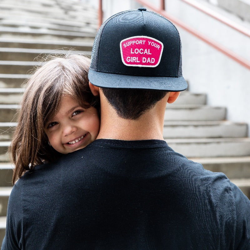 Support Your Local Girl Dad flat bill mesh hat with embroidered patch, charcoal/white and black options.