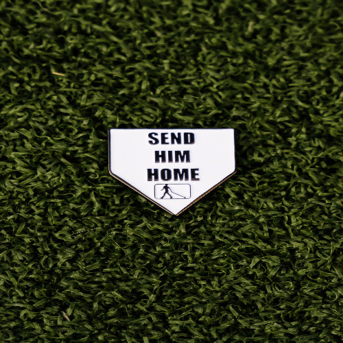 Home plate-shaped golf ball marker with “Send Him Home” text and magnetic backing for easy attachment.
