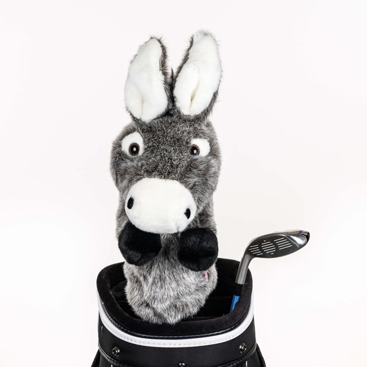Plush donkey golf headcover covering a club in a golf bag, a standout golf gift for men from Groovy Guy Gifts