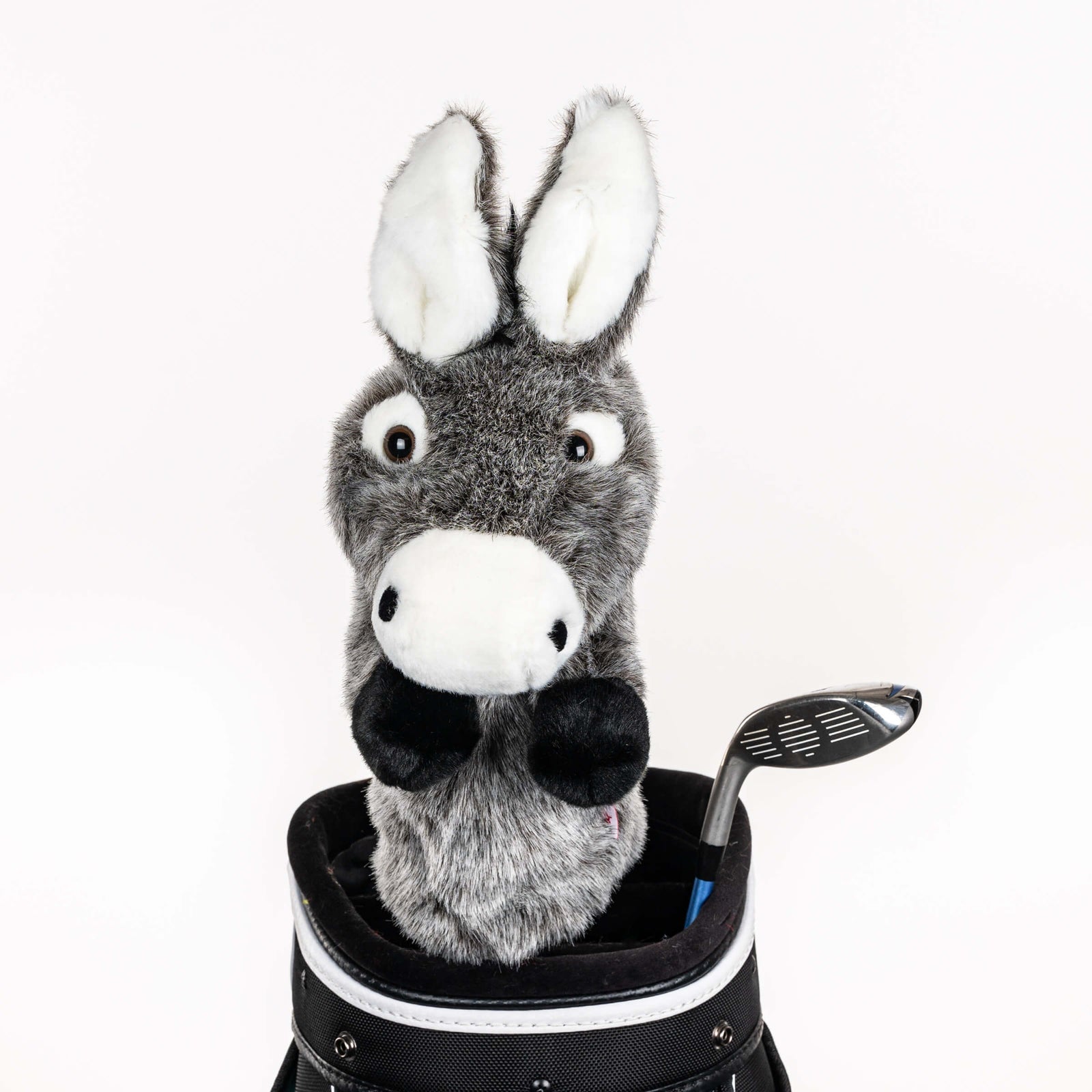 Plush donkey golf headcover covering a club in a golf bag, a standout golf gift for men from Groovy Guy Gifts