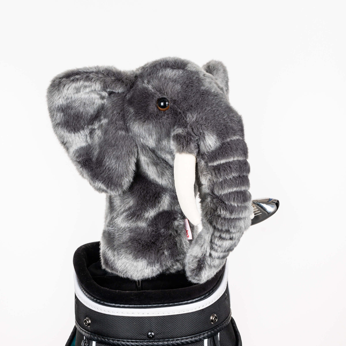 Plush elephant golf headcover covering a club in a golf bag, a standout golf gift for men from Groovy Guy Gifts