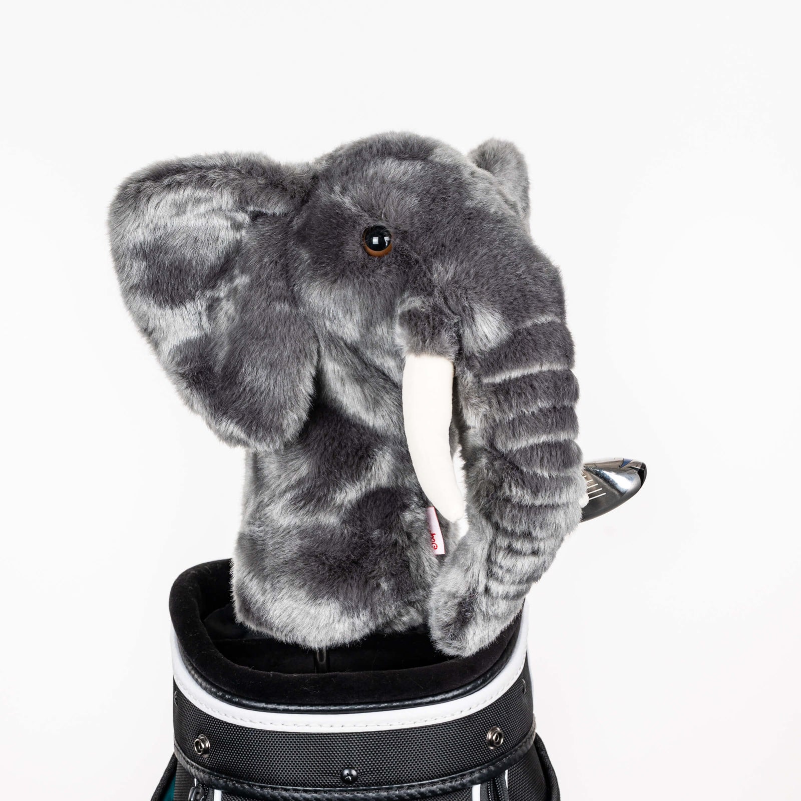 Plush elephant golf headcover covering a club in a golf bag, a standout golf gift for men from Groovy Guy Gifts