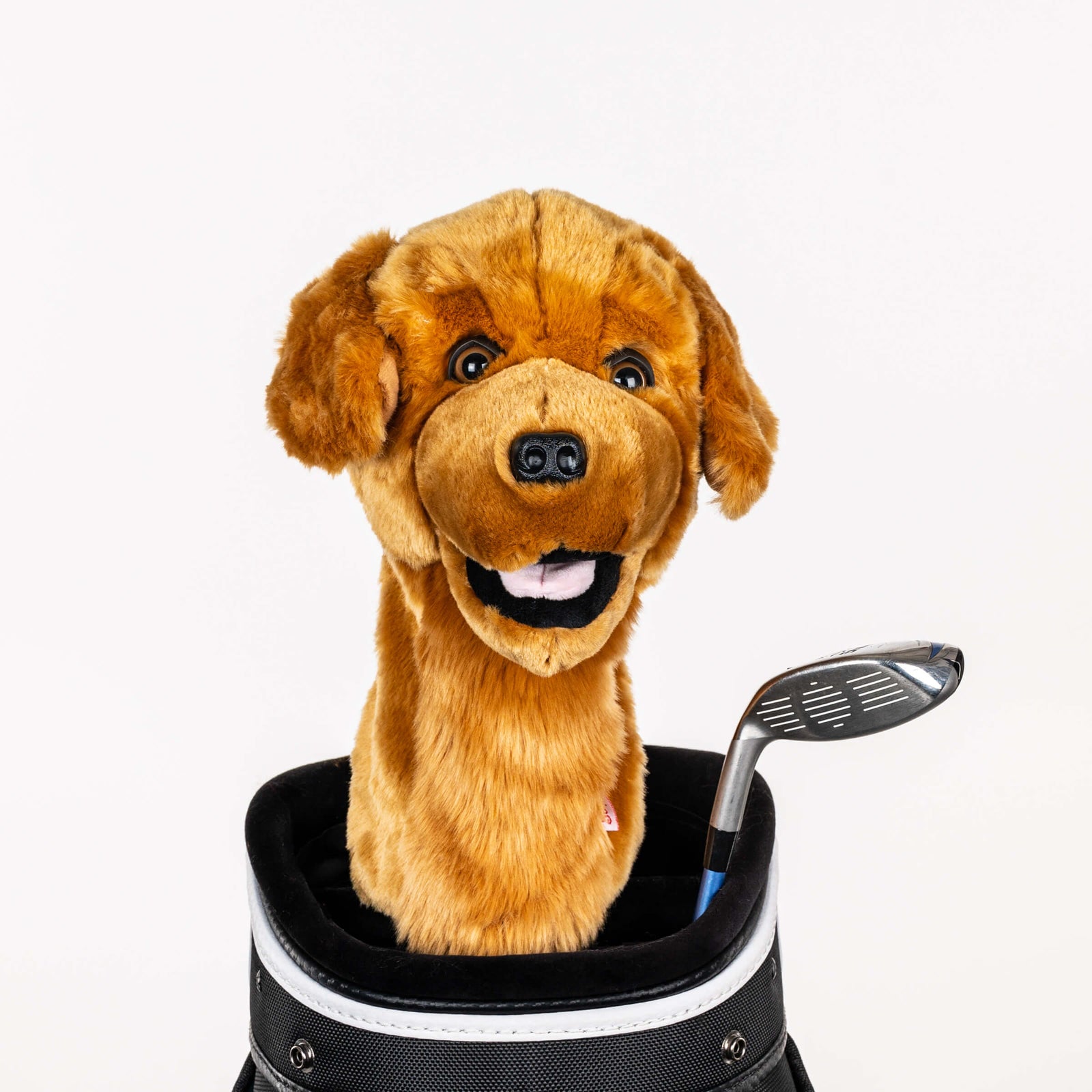 Plush golden retriever golf headcover covering a club in a golf bag, a standout golf gift for men from Groovy Guy Gifts