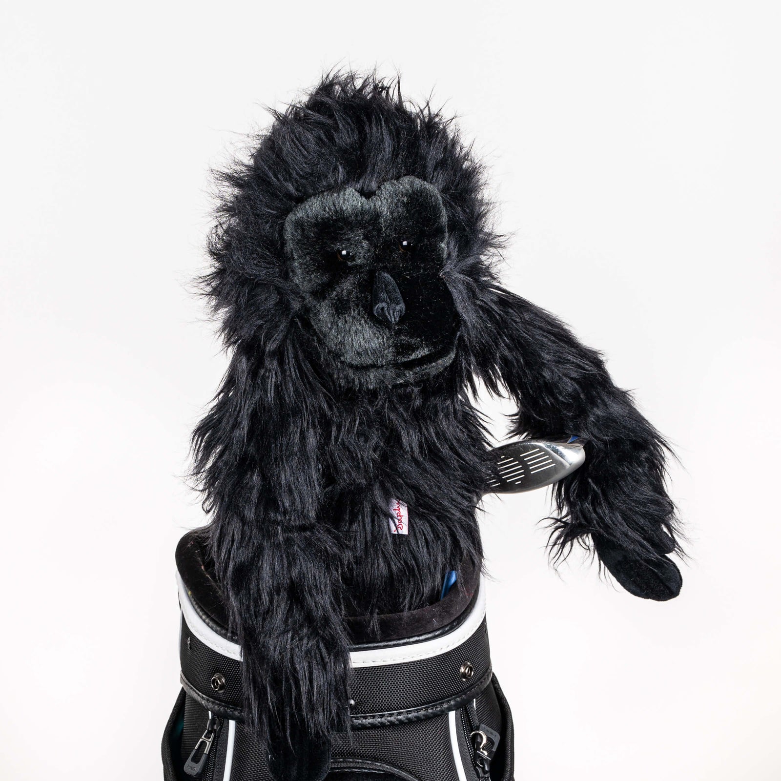Plush gorilla golf headcover covering a club in a golf bag, a standout golf gift for men from Groovy Guy Gifts