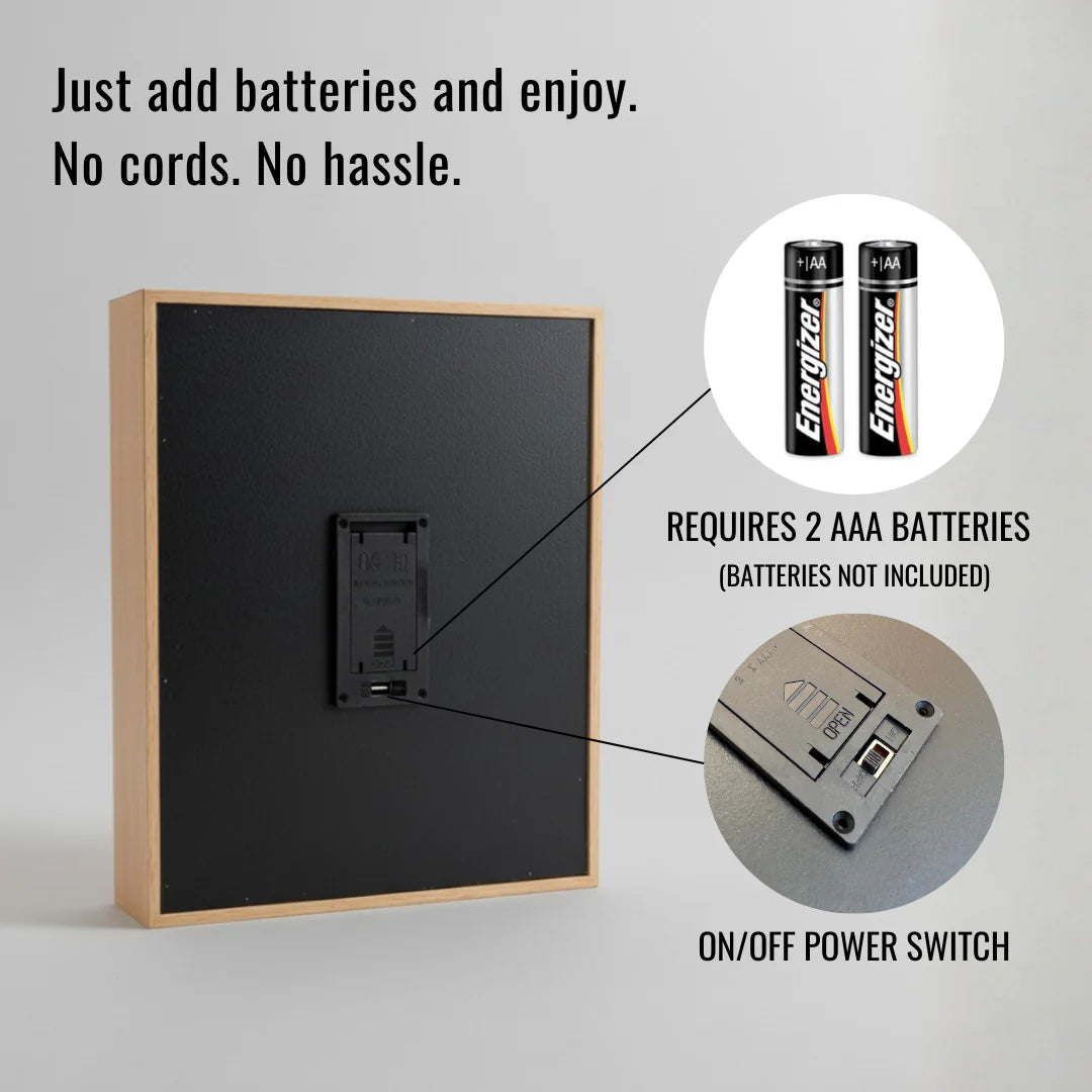 Wood-framed memory light with black acrylic face, showing battery compartment detail and on/off power switch, requires two AAA batteries for operation