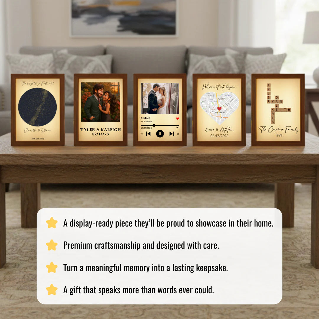 Five framed personalized memory prints displayed on wooden shelf, including star map, couple photos, music player design, heart-shaped map, and family name crossword, each with sample customized text and dates