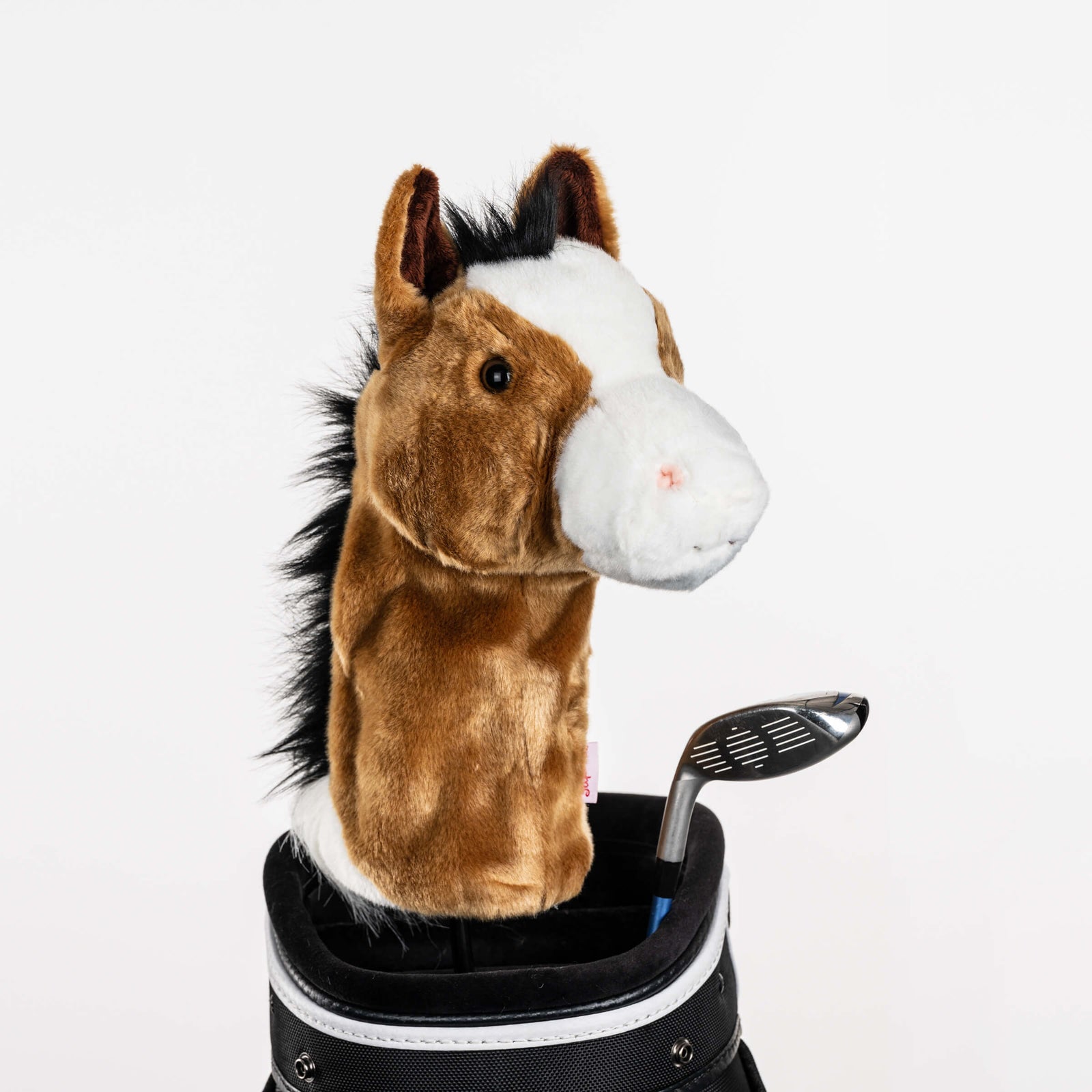 Plush horse golf headcover covering a club in a golf bag, a standout golf gift for men from Groovy Guy Gifts