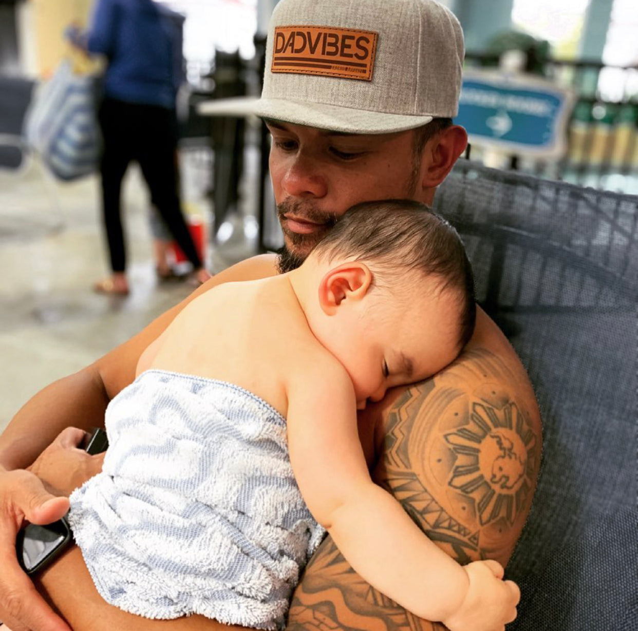 Heather grey Dad Vibes hat with brown leather patch and adjustable snapback.