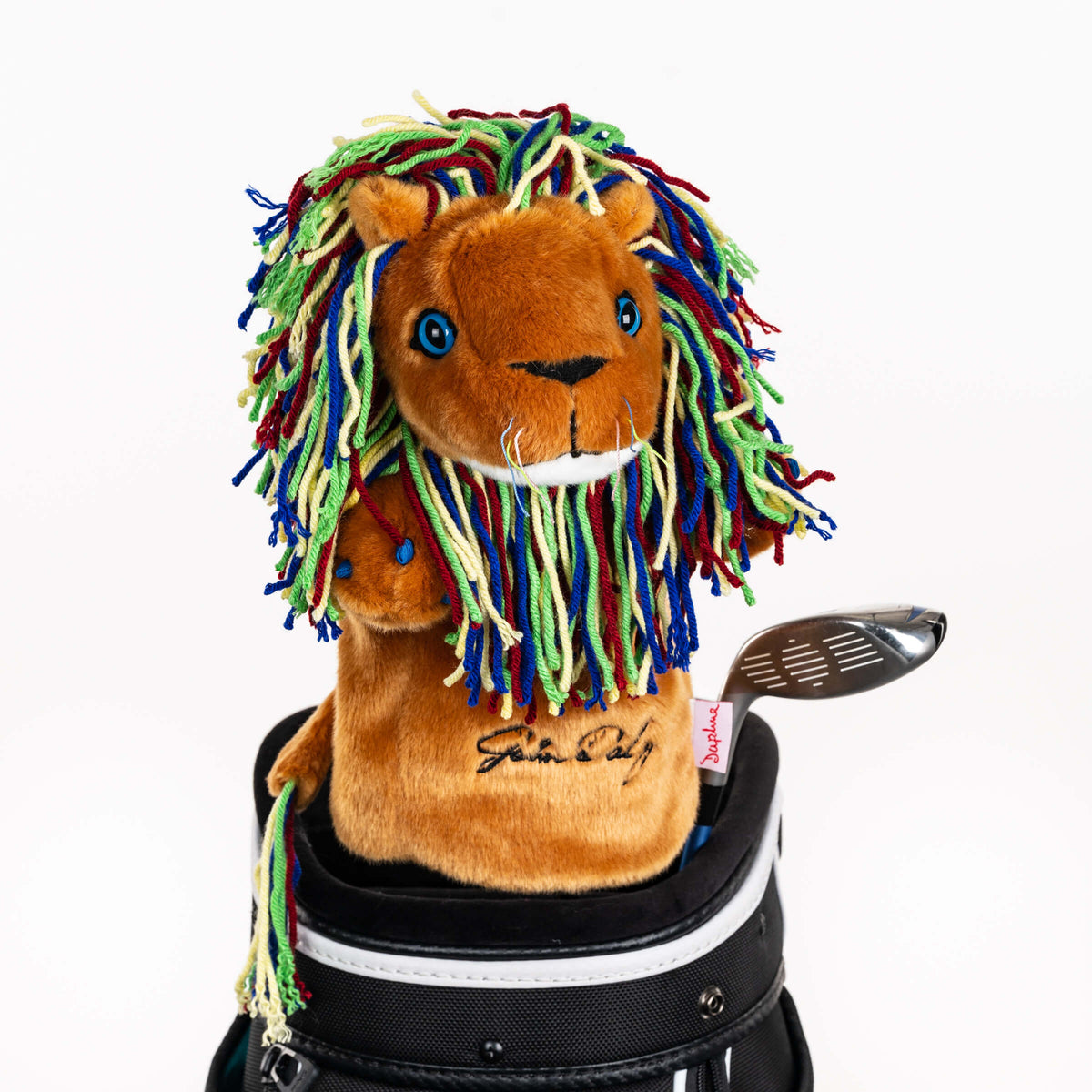 Plush lion golf headcover covering a club in a golf bag, a standout golf gift for men from Groovy Guy Gifts