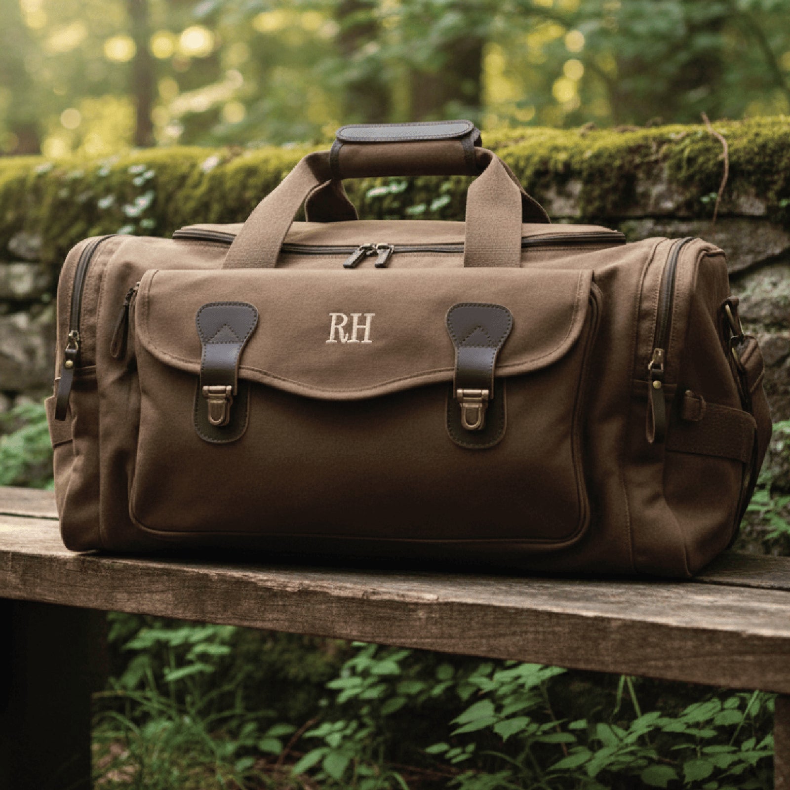 Customized duffel bag, personalized duffle bag with 'RH' monogram on a wooden bench in a natural setting, muscle duffle