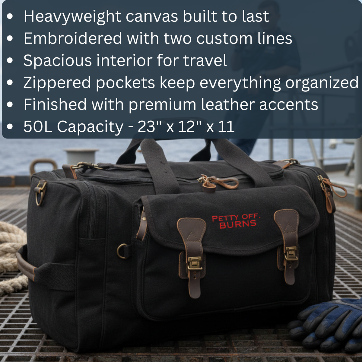 Black canvas duffel bag with brown leather handles and accents, embroidered with sample text "PETTY OFF BURNS" in red, shown outdoors with rope nearby