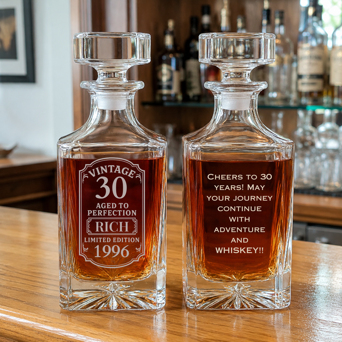 Pair of engraved crystal whiskey decanters with sample personalization showing "Vintage 30" and birthday message with name example.