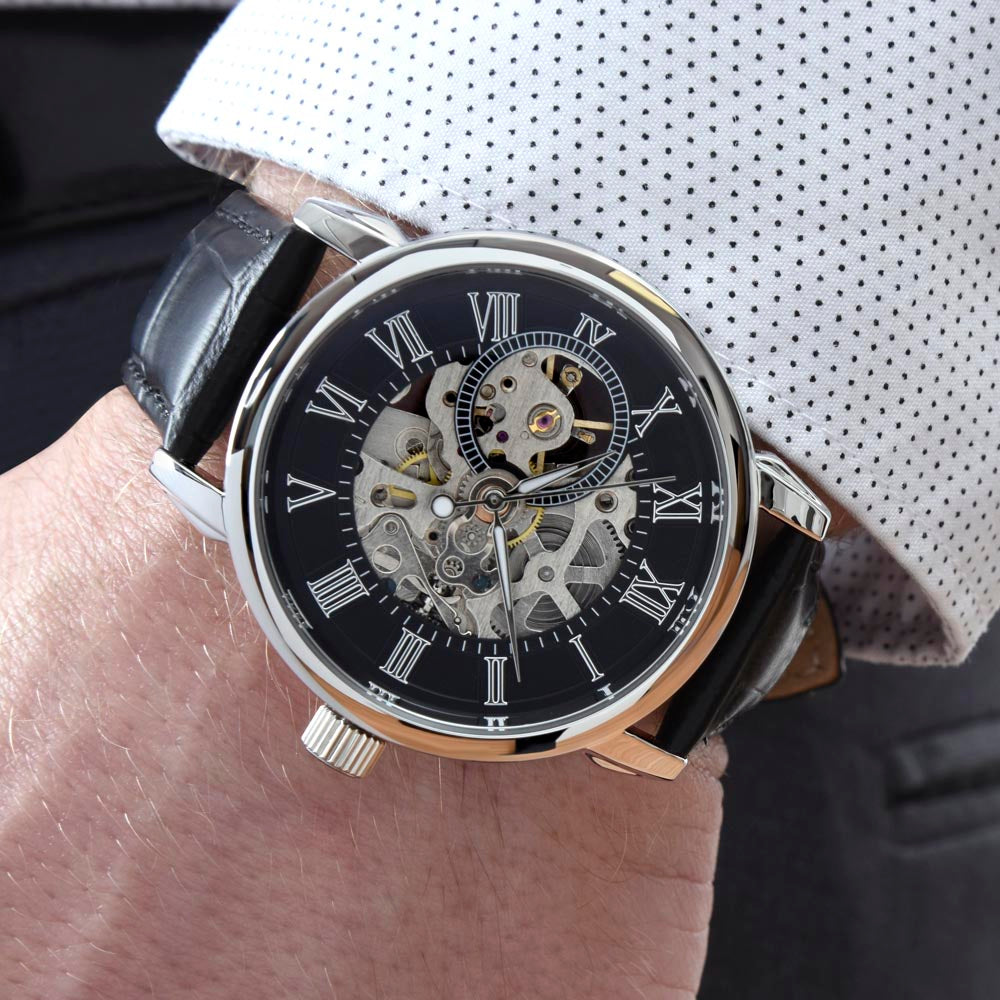 luxury men’s skeleton watch with exposed mechanical movement on wrist