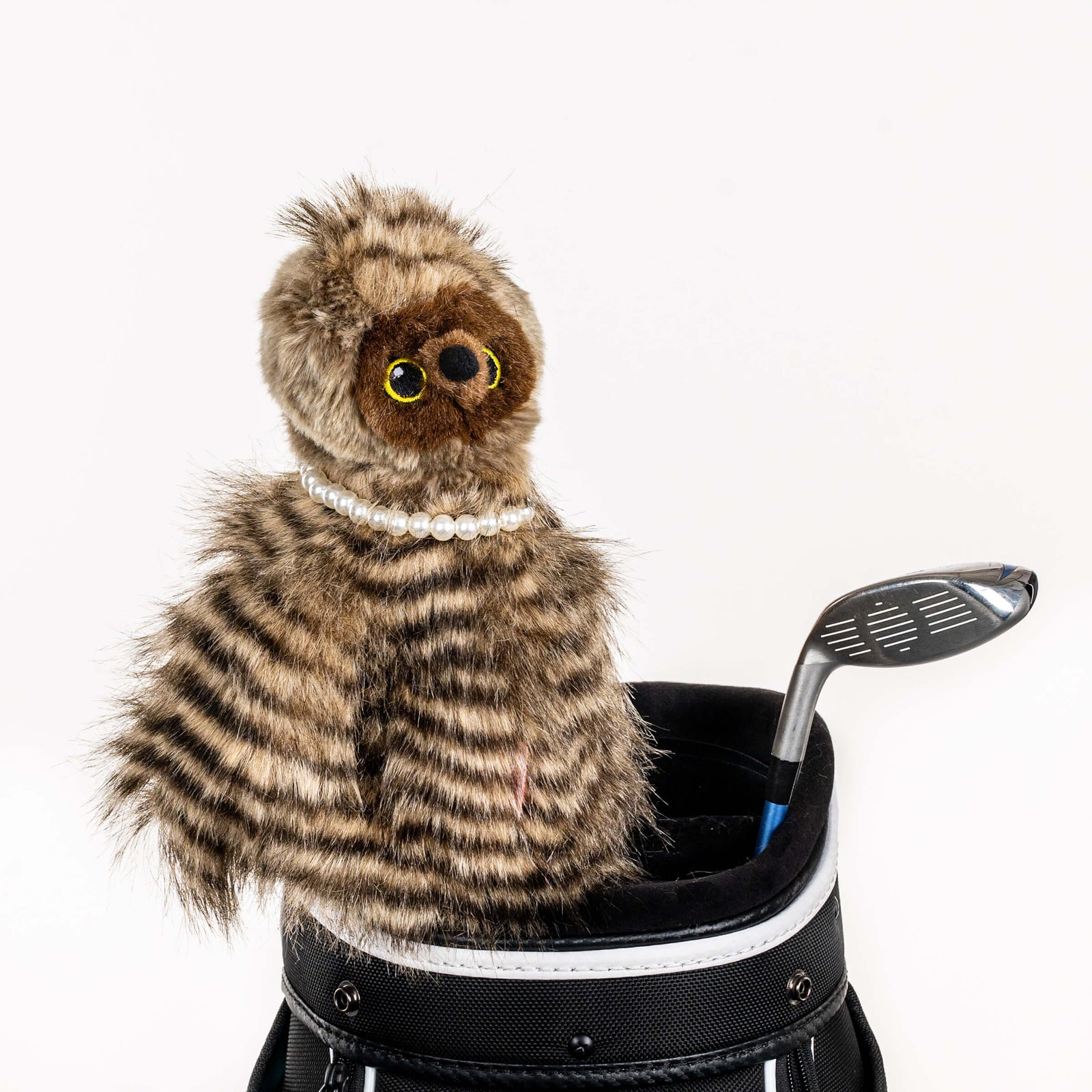 Plush owl golf headcover covering a club in a golf bag, a standout golf gift for men from Groovy Guy Gifts