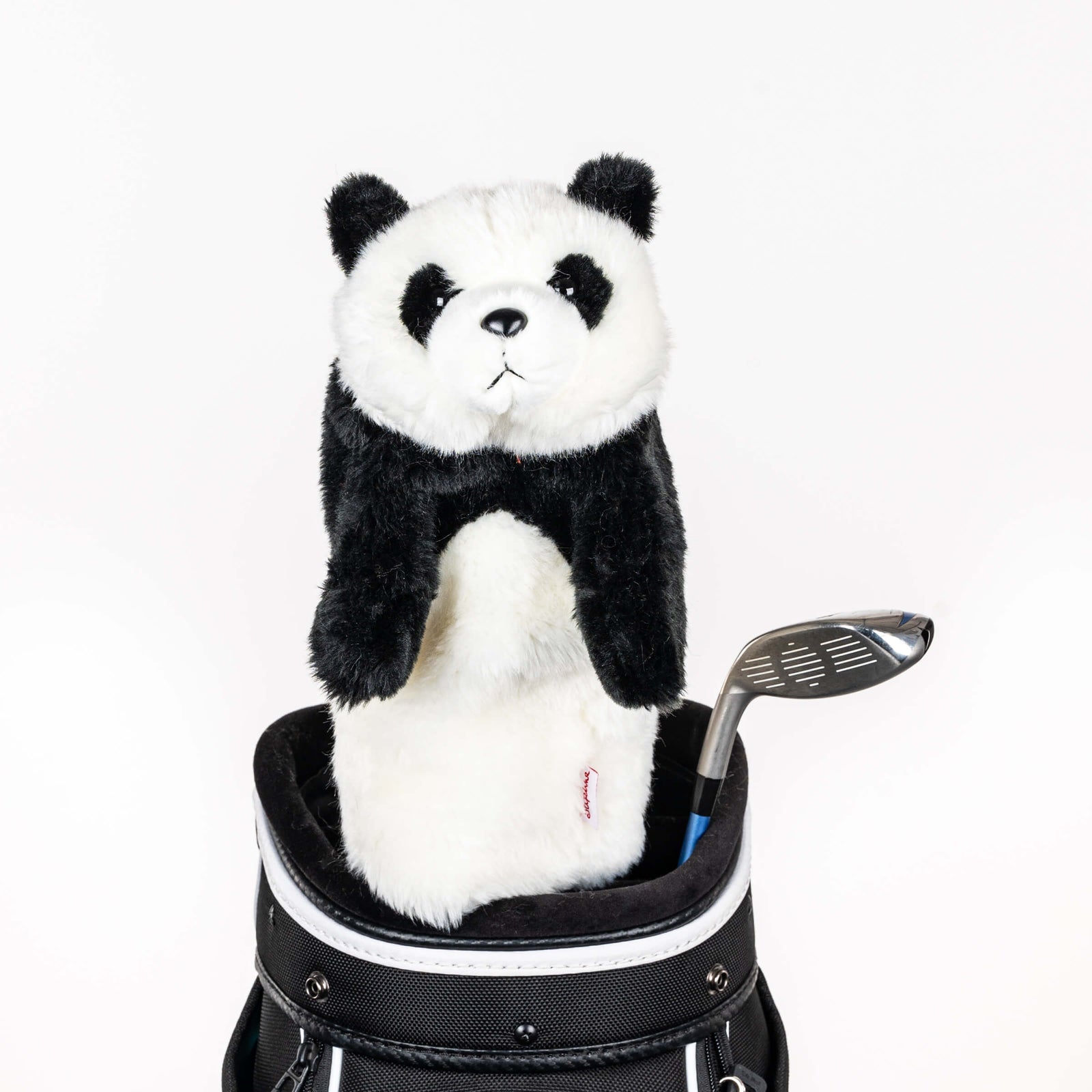Plush panda golf headcover covering a club in a golf bag, a standout golf gift for men from Groovy Guy Gifts