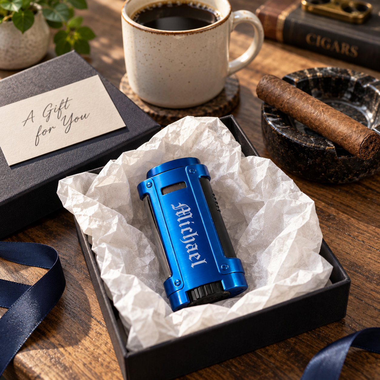 A blue personalized cigar lighter engraved Michael unwrapped from  paper beside a cigar and coffee, a nice cigar lighter gift