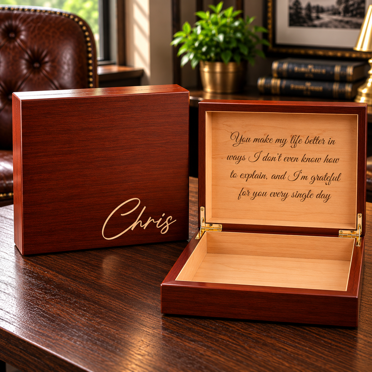 Dark wood box set with open lid revealing light wood interior, engraved with sample message "You make my life better in ways I don't even know how to explain, and I'm grateful for you every single day," and matching closed box with sample engraving "Chris