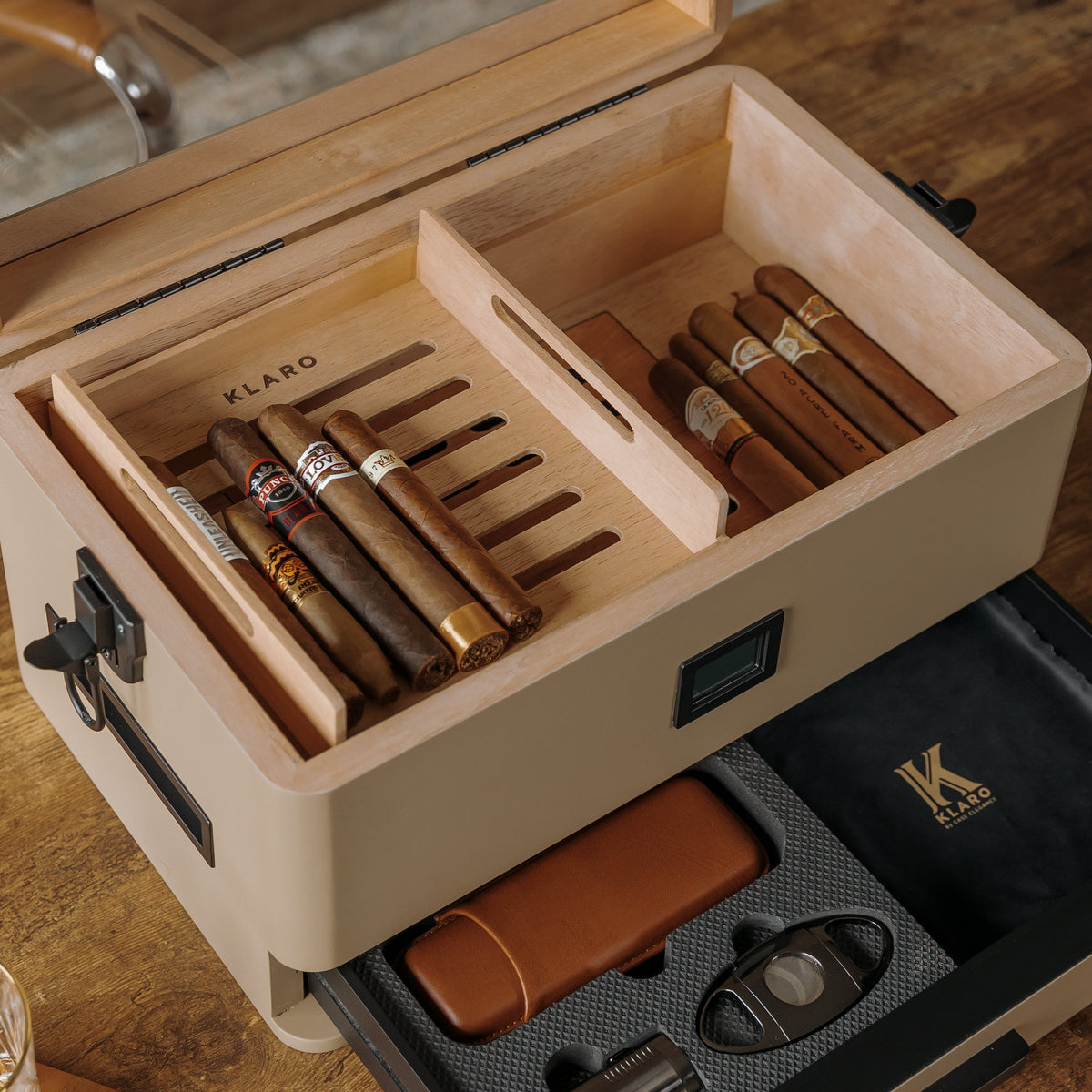 Coyote tan military cigar humidor with Spanish cedar lining, black corner guards, and storage drawer.