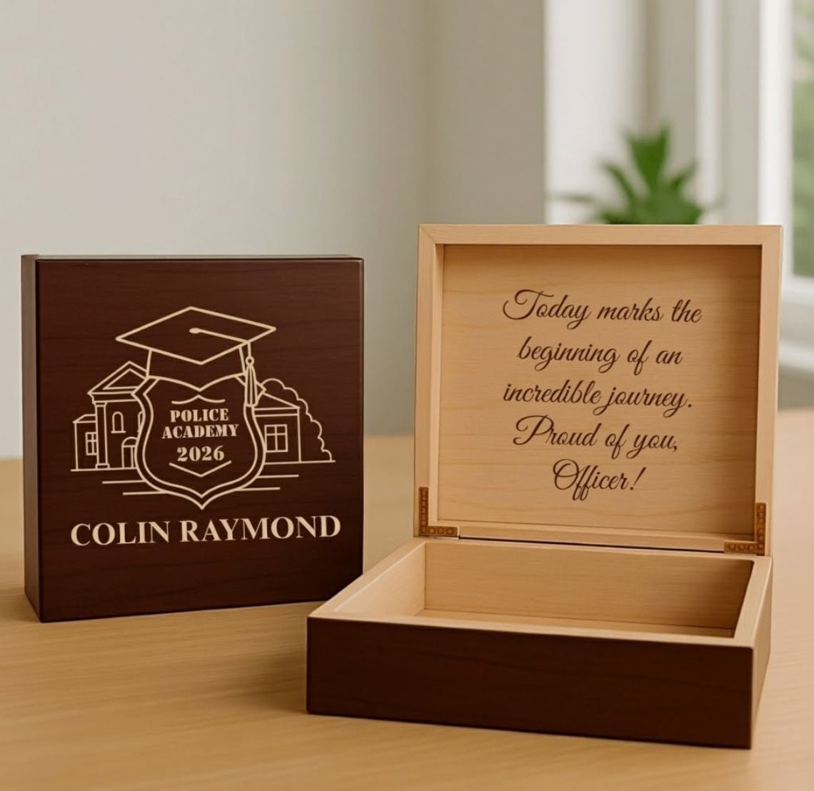 Wooden police graduation gift box with engraved text and design, placed on a wooden surface.