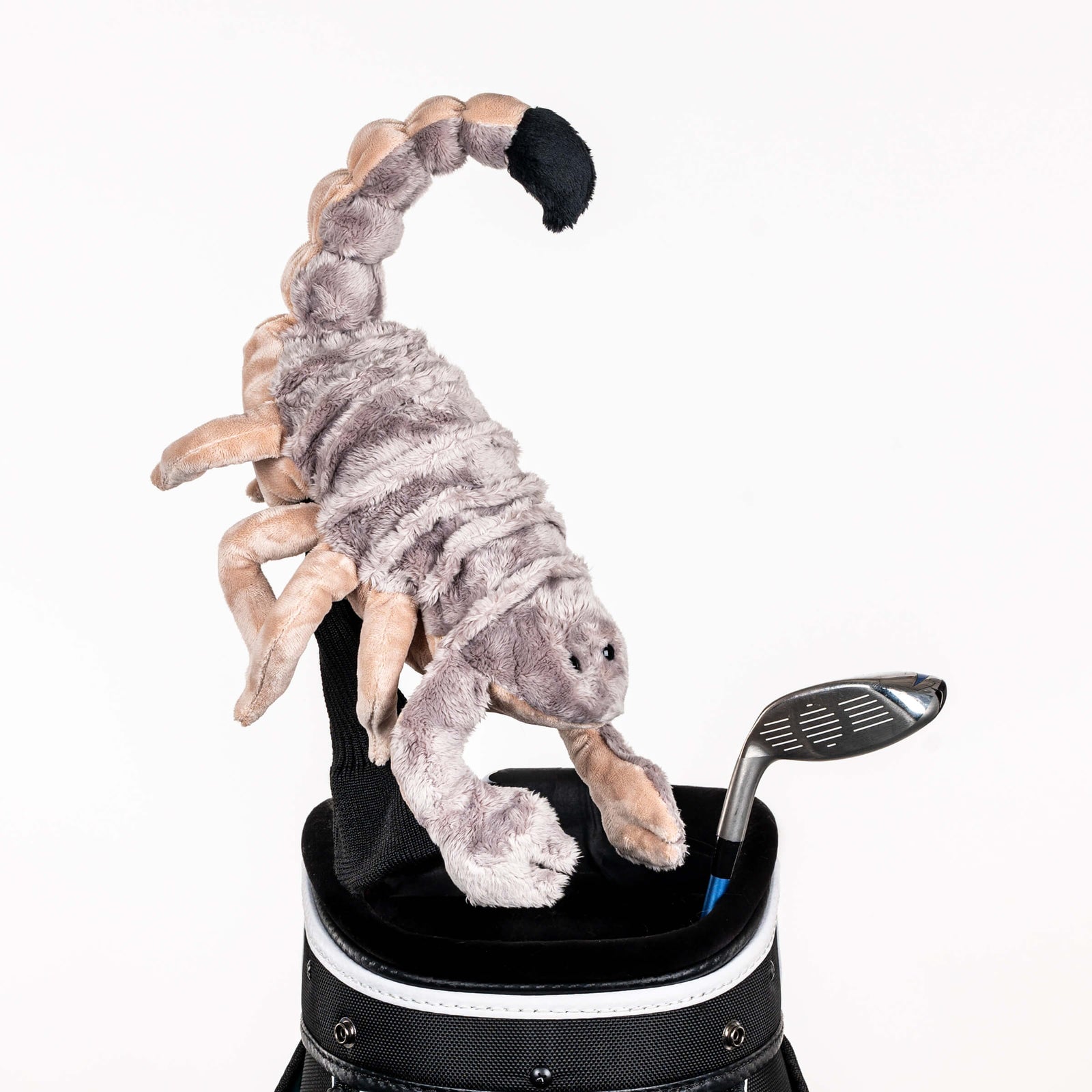 Plush scorpion golf headcover covering a club in a golf bag, a standout golf gift for men from Groovy Guy Gifts