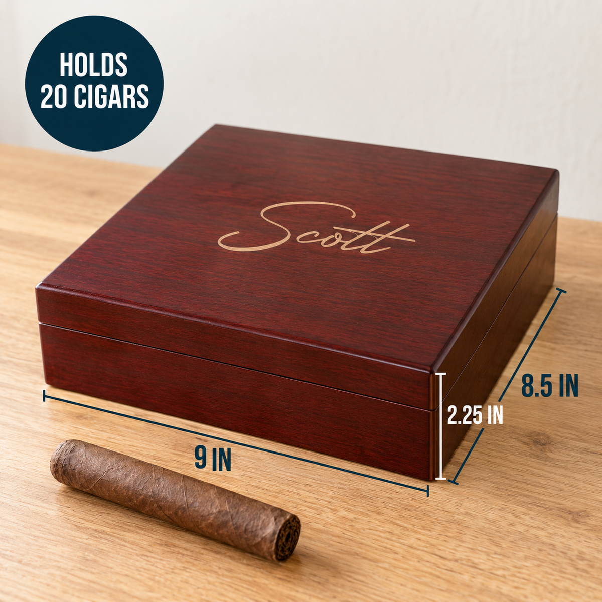 Dark wood cigar box with "Scott" engraved in gold script, dimensions shown, holds 20 cigars, displayed with sample cigar on wood surface