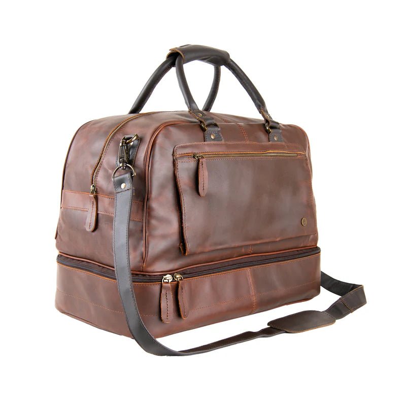 Vintage brown personalized leather bag for men at a three quarter angle, showing the side zipper, the shoulder strap clip and the zipped lower compartment