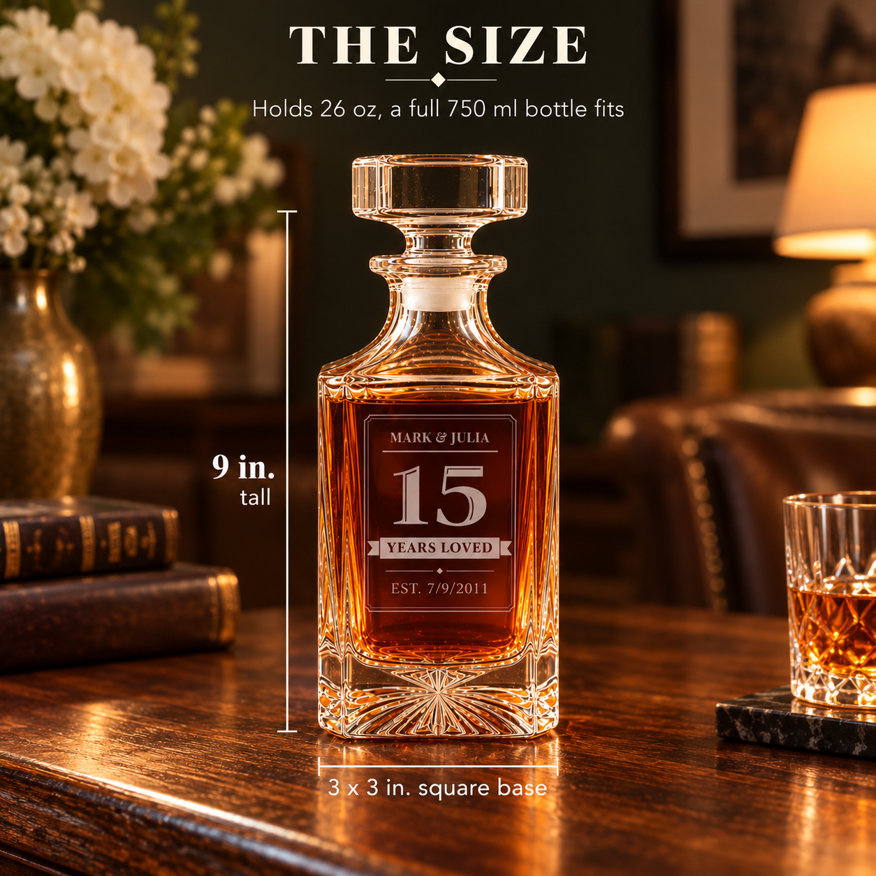 Size of the engraved 15 year anniversary decanter for him: 9 inches tall with a 3 x 3 inch square base, holds 26 oz so a full 750 ml bottle fits
