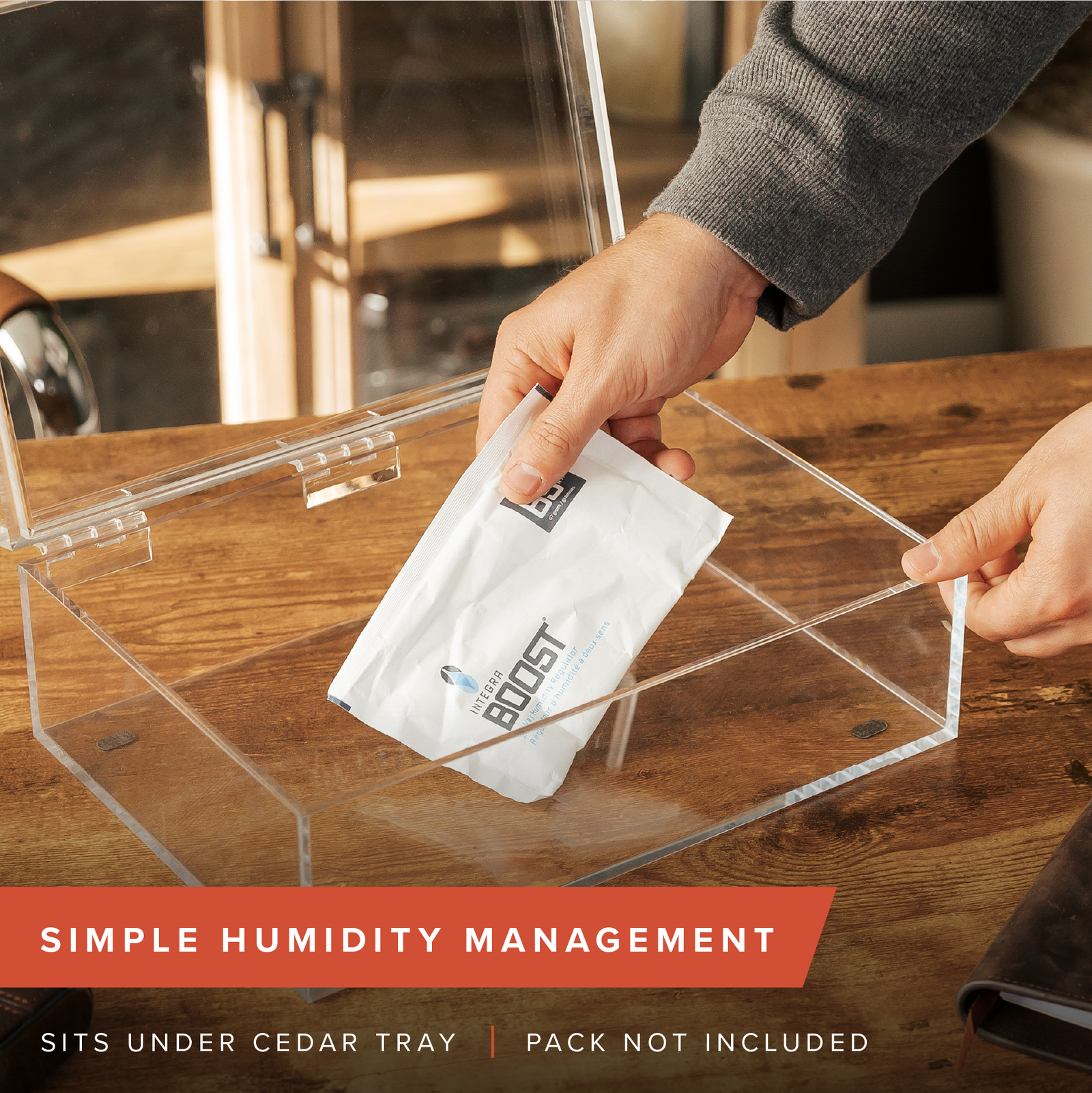 Clear acrylic cigar humidor with Spanish cedar tray and digital hygrometer.