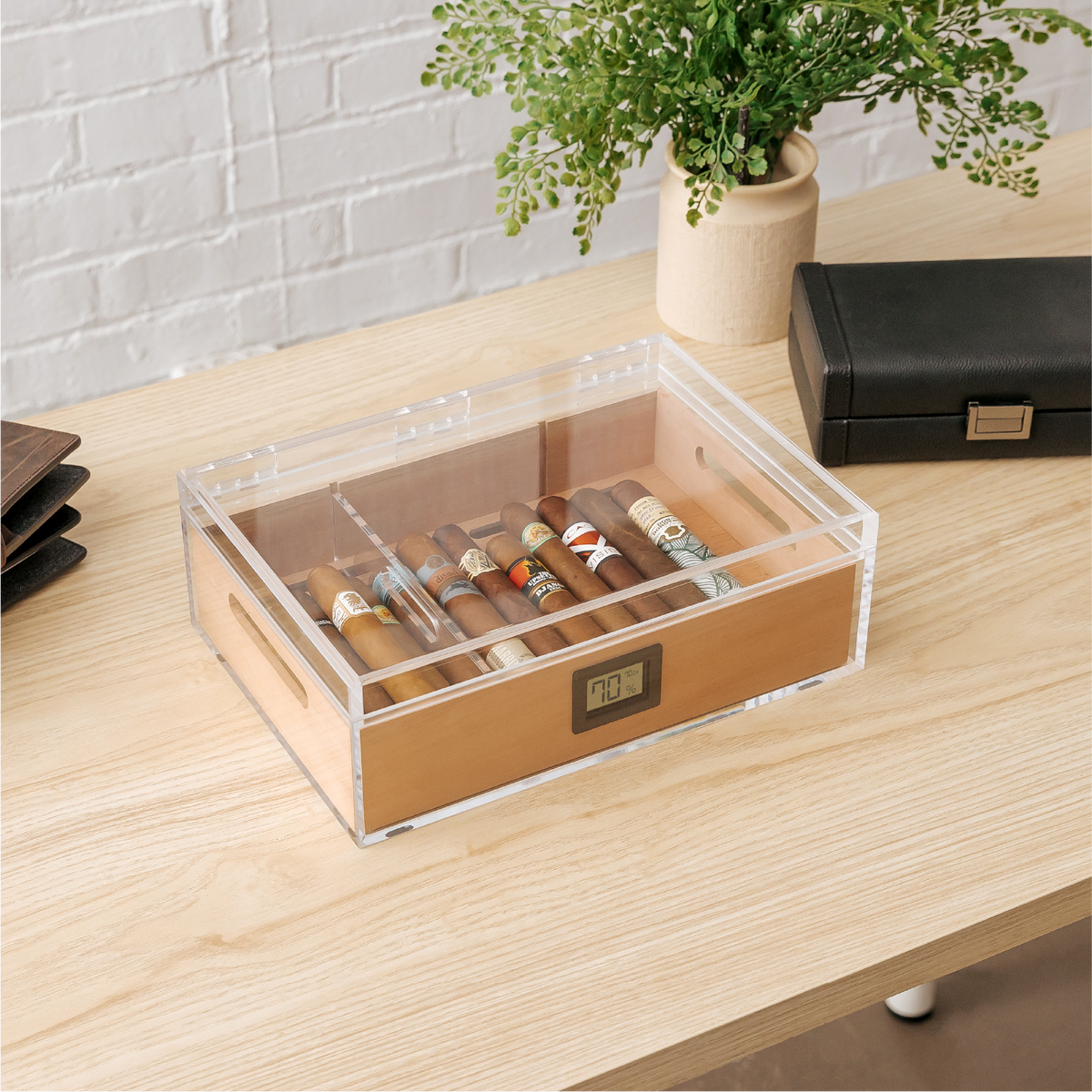 Clear acrylic cigar humidor with Spanish cedar tray and digital hygrometer.