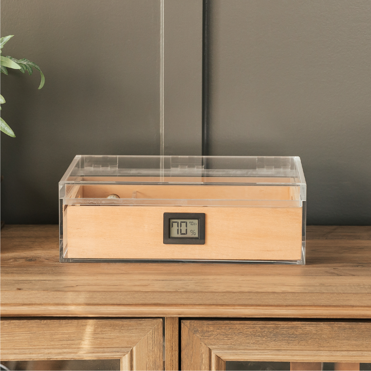 Clear acrylic cigar humidor with Spanish cedar tray and digital hygrometer.