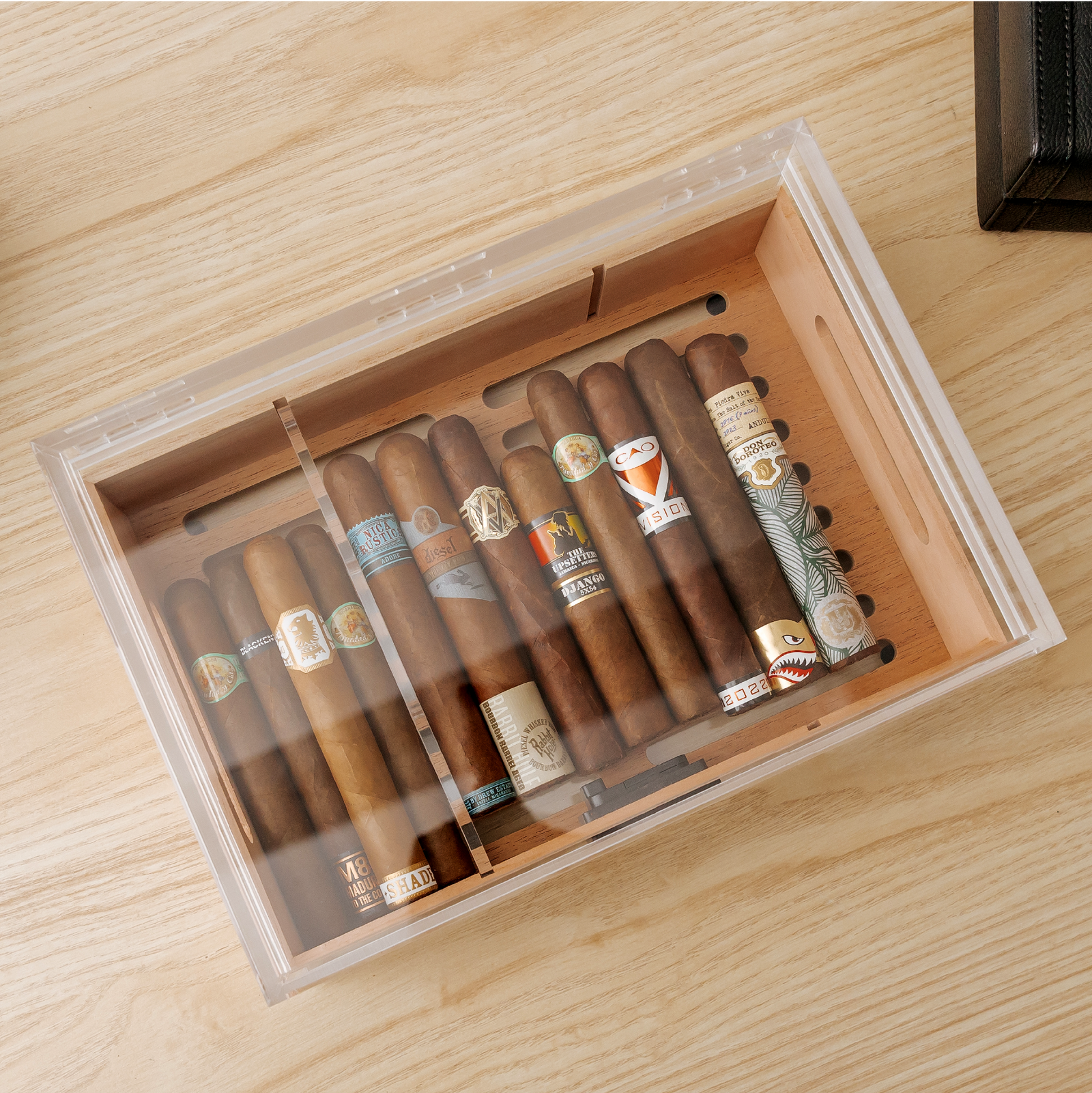 Clear acrylic cigar humidor with Spanish cedar tray and digital hygrometer.