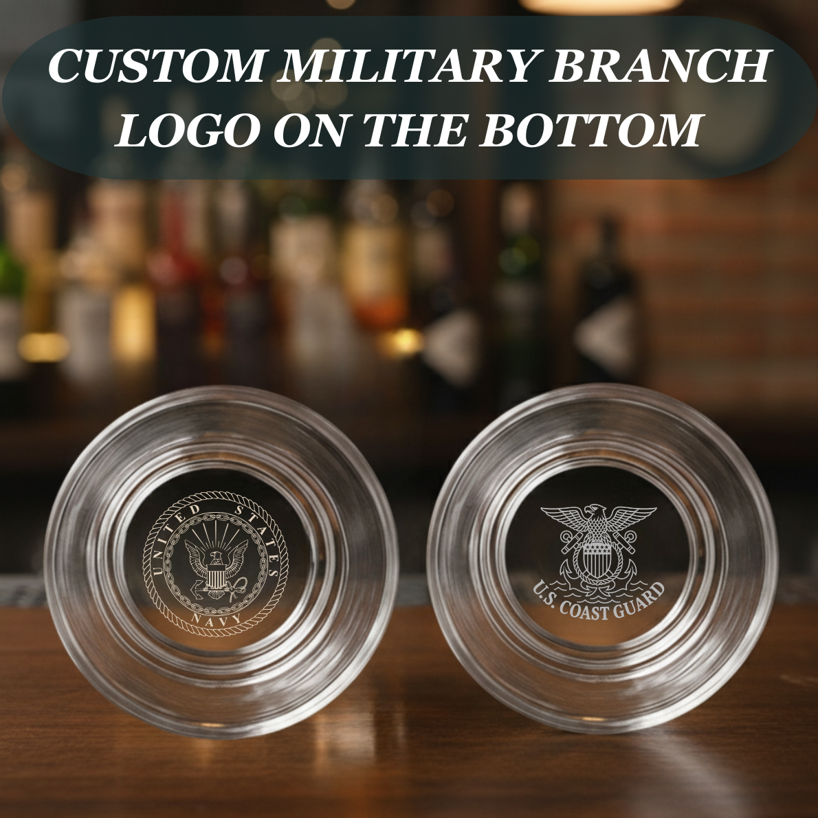 Two engraved whiskey glasses with sample U.S. Navy and Coast Guard military branch logos on the bottom, viewed from above on a wooden bar surface.