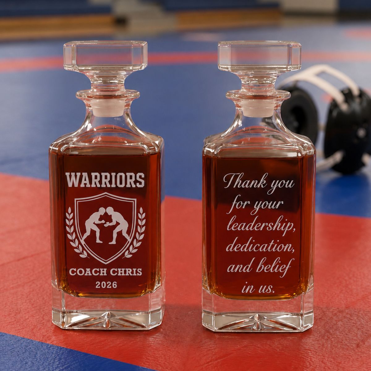 Personalized wrestling coach whiskey decanter engraved with custom team name, coach name, and year, featuring a deep-etched wrestling design on premium glass.
