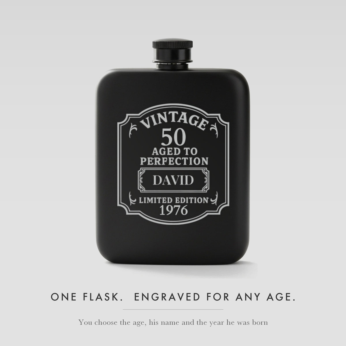Personalized vintage birthday flask in matte black steel, laser engraved Vintage 50 Aged to Perfection with the name David and the year 1976 on the label.