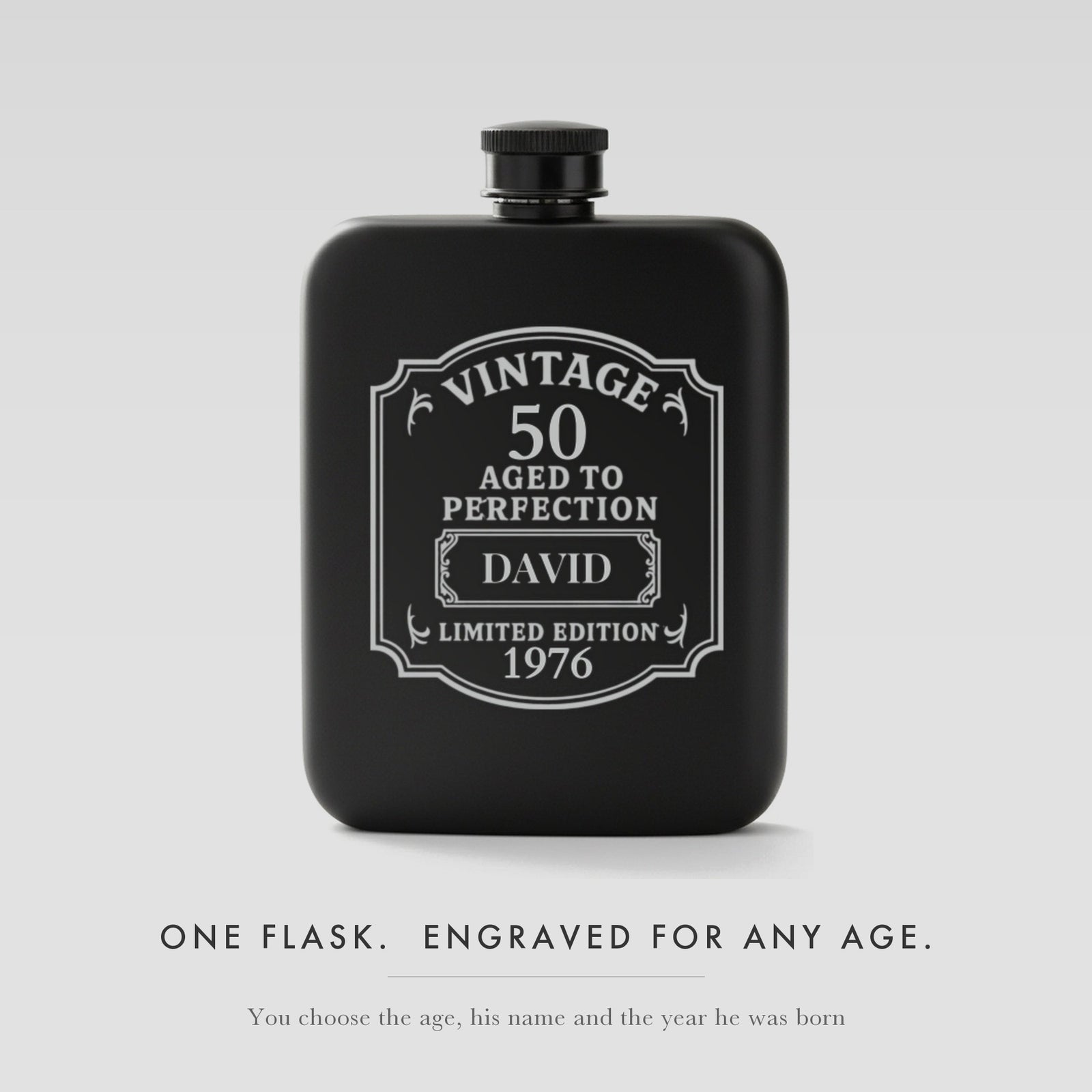 Personalized vintage birthday flask in matte black steel, laser engraved Vintage 50 Aged to Perfection with the name David and the year 1976 on the label.