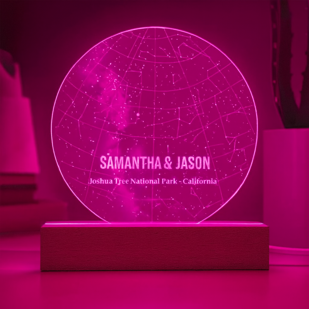 Personalized star map plaque with sample engraving "Samantha & Jason, Joshua Tree National Park - California" glowing in magenta neon light on wooden base