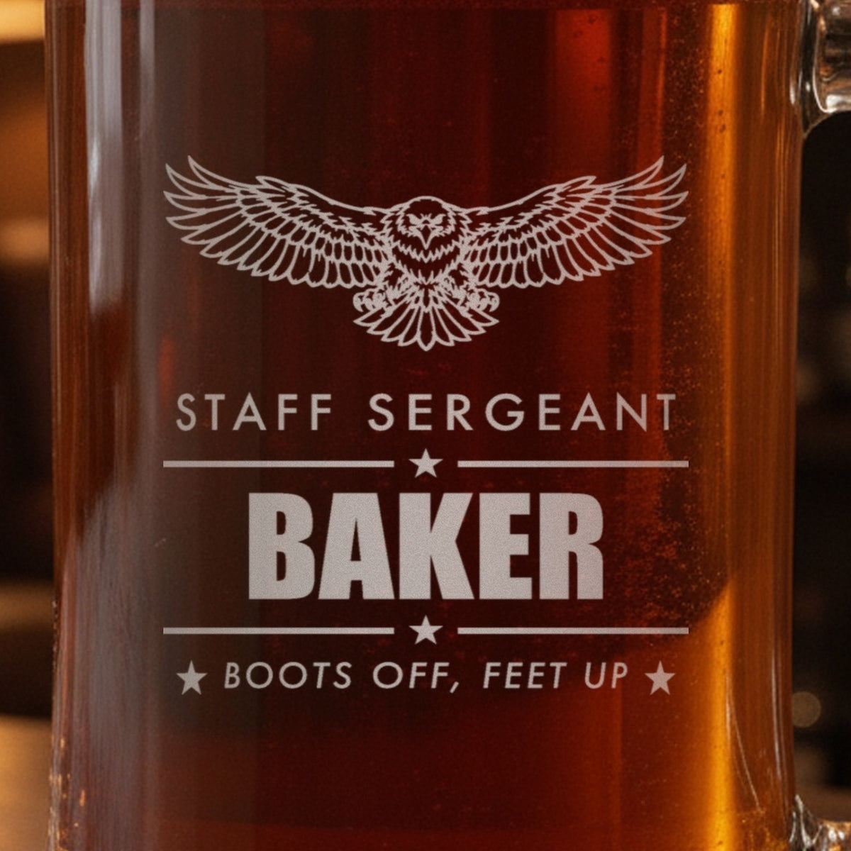 Close-up of the frosted eagle engraving on a retired Army gift stein: Staff Sergeant, Baker between star rules and Boots Off, Feet Up