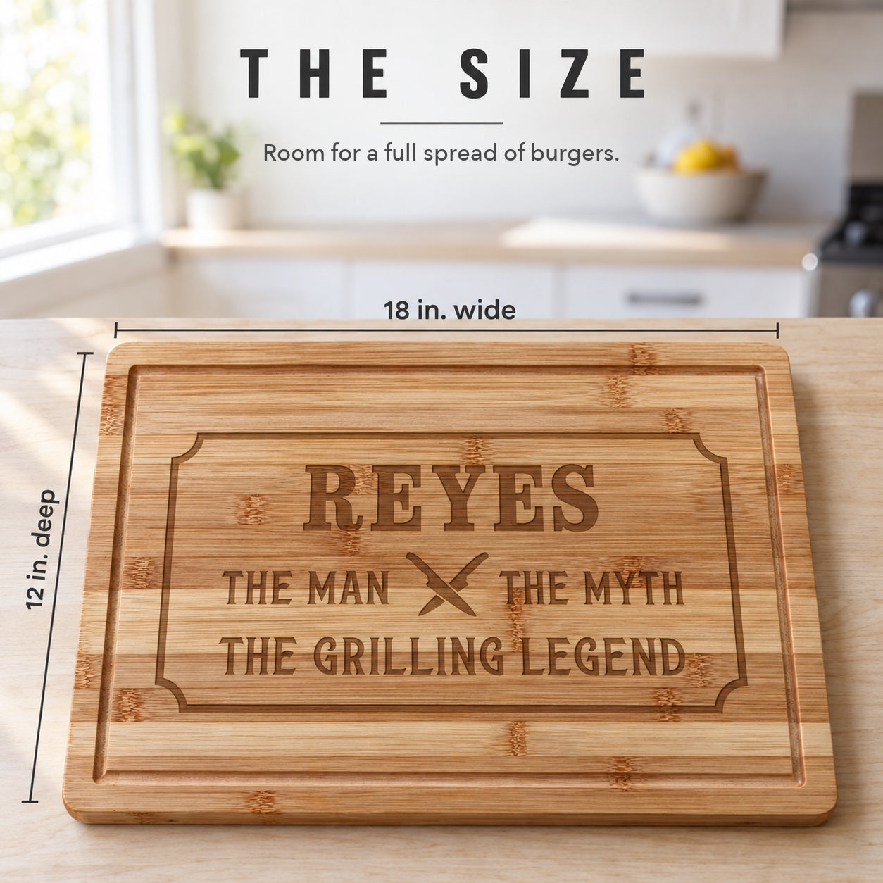 Size of the engraved bamboo cutting board for men: 18 inches wide and 12 inches deep, engraved REYES and THE GRILLING LEGEND, on a kitchen counter