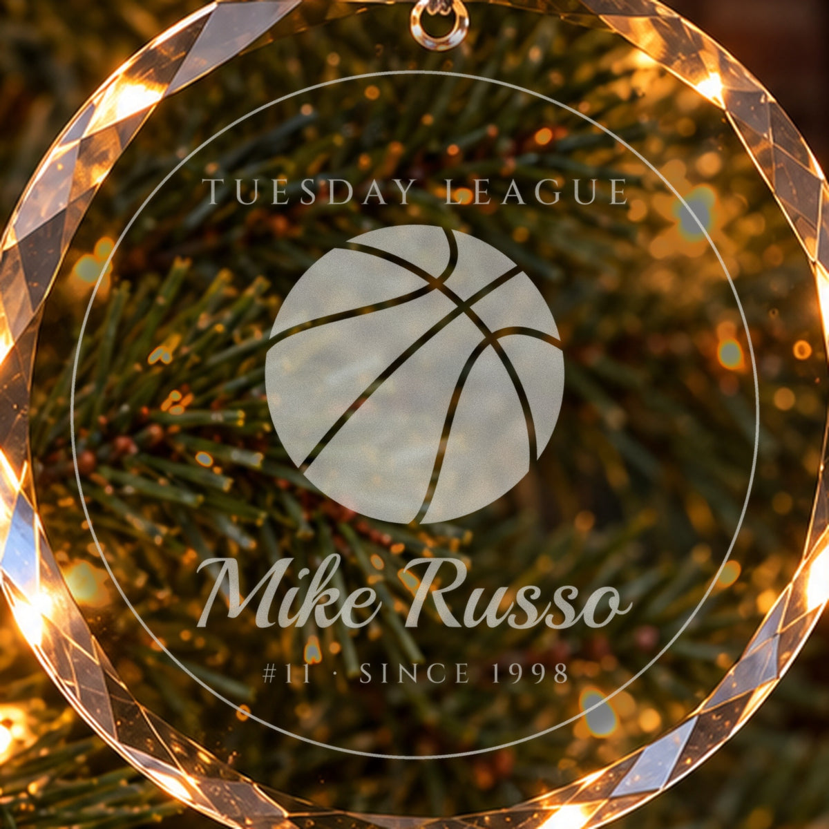 Close-up of the frosted engraving on the basketball Christmas ornament: a big basketball, TUESDAY LEAGUE, Mike Russo, #11 · SINCE 1998