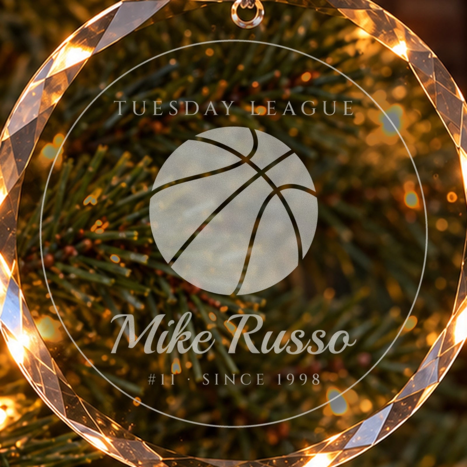 Close-up of the frosted engraving on the basketball Christmas ornament: a big basketball, TUESDAY LEAGUE, Mike Russo, #11 · SINCE 1998