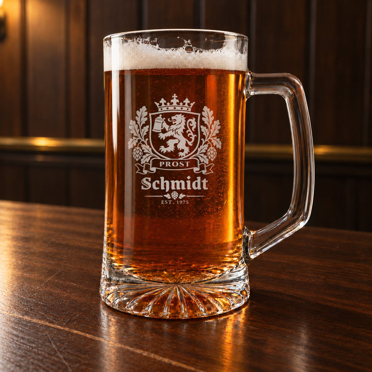 Personalized beer stein on a bar, engraved with a crowned Bavarian crest, a lion holding a stein, oak leaves and hops, Prost, Schmidt and Est. 1975
