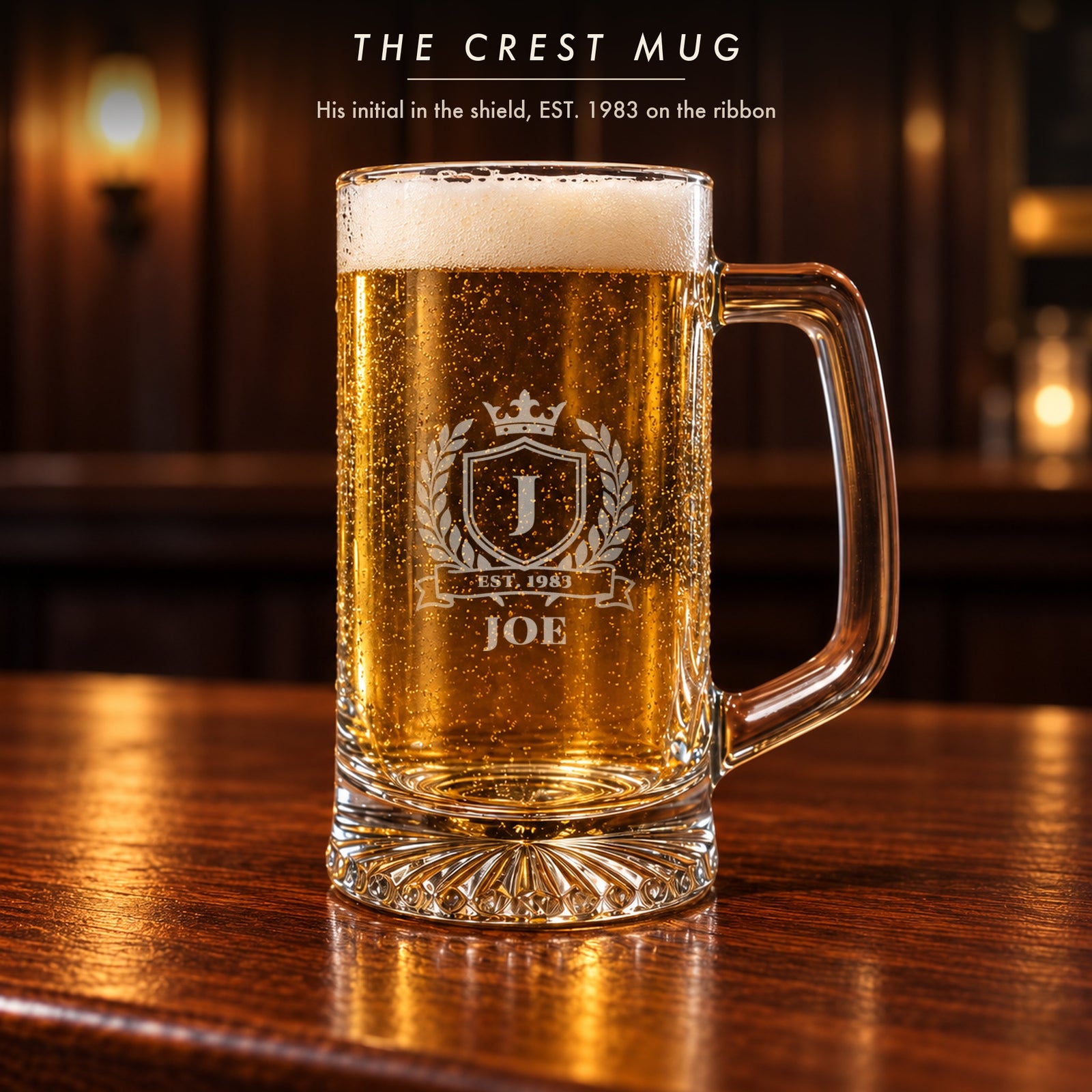Close-up of the crest beer mug from the birthday gift set: initial J in the shield, EST. 1983 on the ribbon and Joe engraved below