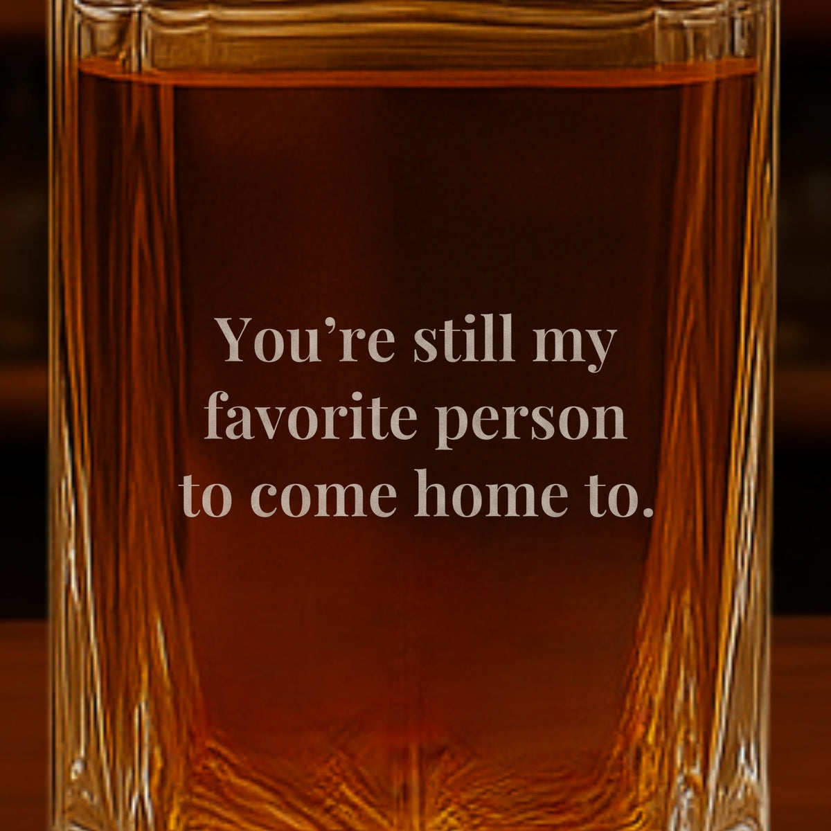 Close-up of a love note engraved on the back of a whiskey decanter, a romantic gift for boyfriend that reads You're still my favorite person